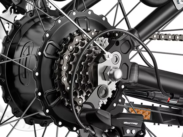 Close-up of a bicycle gear system with a visible brand logo.