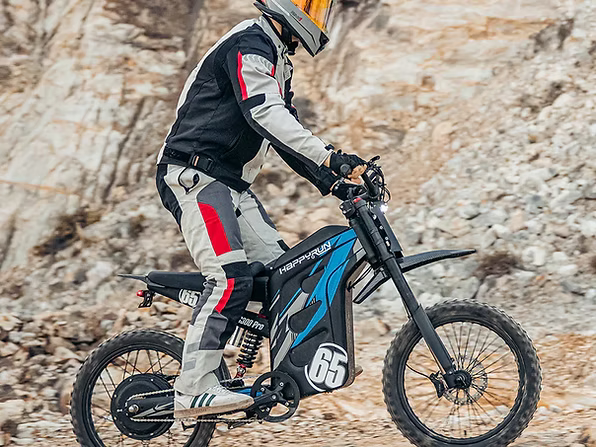 Person riding a dirt bike on rocky terrain